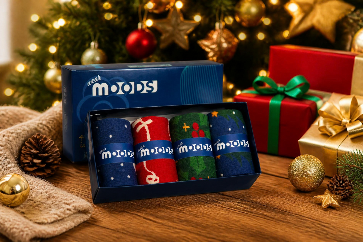 A boxed set of four patterned socks. The socks show the visible brand name 'Wear Moods'.