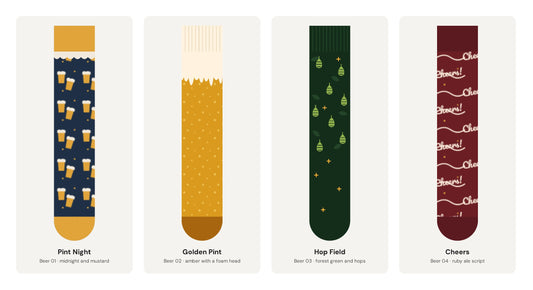 The four Beer Mood sock designs in the gift box: Pint Night, Golden Pint, Hop Field and Cheers