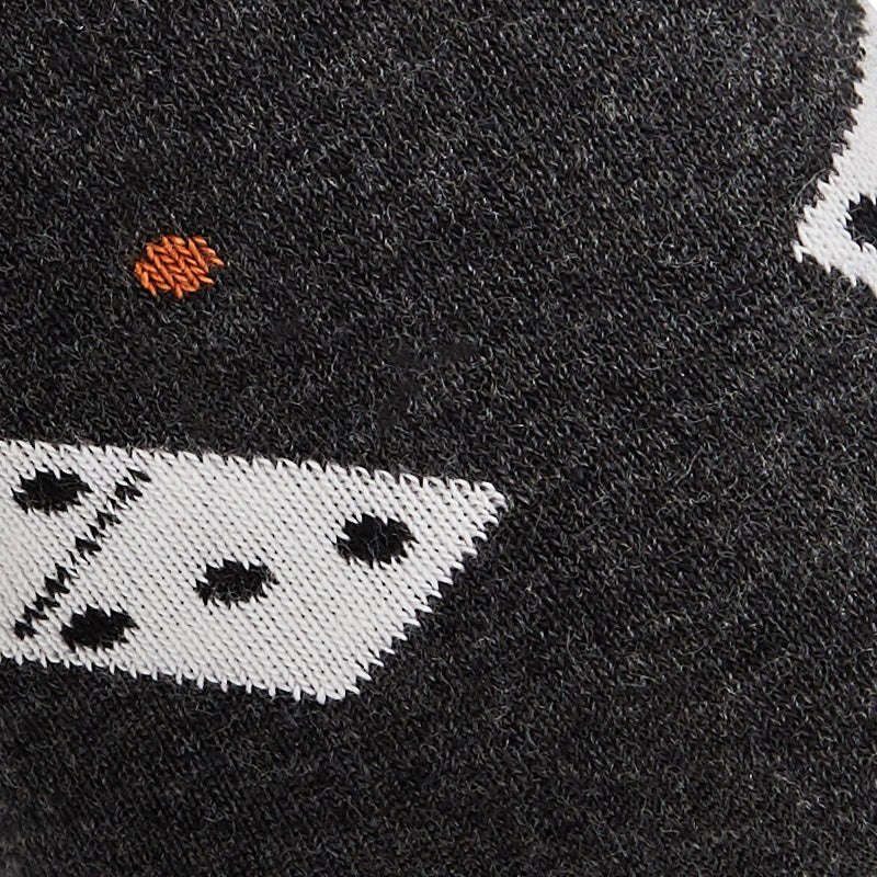 Close-up of the knitted domino tile and orange dot detail on WearMoods Domino socks