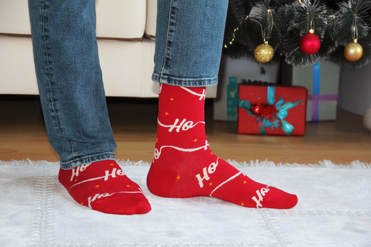 Ho Ho Christmas socks – all-over red with a white script ribbon